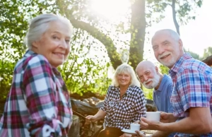 A group of elderly people facing a camera.