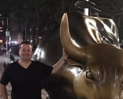 Rob Laurie with a bull statue.